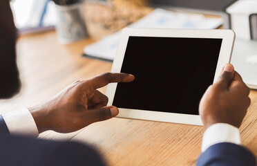 Poster - Cropped image of african businessman touching blank digital tablet screen, business application, empty space
