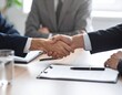 © Hafizh - Close-up of a Professional Handshake Between Two Business Partners in an Office Meeting