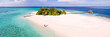 © Matteo Colombo - Aerial panoramic of couple on a beach on a small island in the Maldives