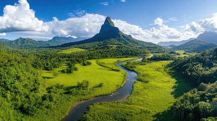Leinwandbilder - Majestic mountain peak towering above lush green valley with a winding river, clear crisp air and blue sky