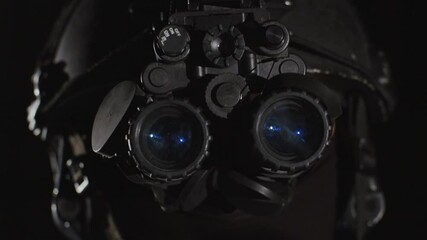 Wall Mural - Closeup of special forces trooper using advanced night vision binocular optics