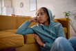 © Drazen - Sad African American teenage girl thinking of something at home.