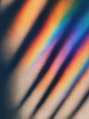 Poster - Colorful light patterns casting shadows on a textured surface, creating a vibrant backdrop
