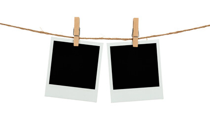 two blank polaroid photo frames clipped to a rope with wooden pegs, isolated on transparent backgrou