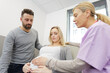 © auremar - pregnant woman with her husband in clinic