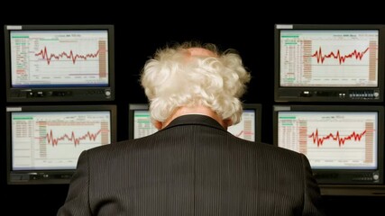 Poster - An older man in a suit stressed while monitoring stock market graphs on multiple screens.