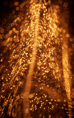 Poster - Golden glowing particles in glass geometry, 3d rendering.