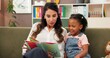 © peopleimages.com - Psychologist, child and reading story in office for speech therapy, mental health and learning. Therapist woman, book and girl for evaluation, clinic or consultation for patient development support