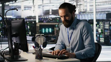 Poster - angry data center engineer banging fist on desk after seeing system failure. server farm it expert r