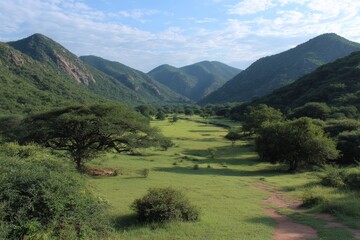 Aufkleber - Lush green valley surrounded by mountains under a clear blue sky during daytime