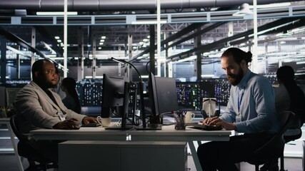 Poster - angry data center engineer banging fist on desk after seeing system failure. server farm it expert r