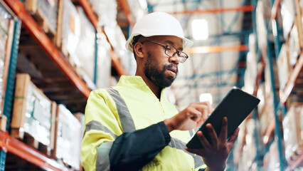 Poster - Distribution, below and man with tablet in warehouse, quality assurance and inventory management. Digital checklist, logistics and African inspector in factory for stocktaking on tech with shipping