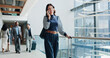 © CC2000/peopleimages.com - Business trip, smile and woman with suitcase, phone call or communication for travel arrangement. Talking, foreign service consultant and chat on mobile for departure, employee and person at airport