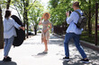 © New Africa - Professional photographers with reflector and camera near model during shooting outdoors on sunny day