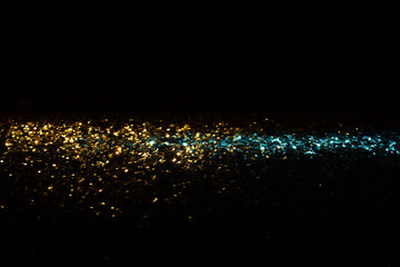 Wall Mural - abstract glitter blue and gold lights background. de-focused
