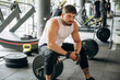 © standret - Strong man is working out in the gym