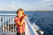 © Tomsickova - People, enjoying ferry ride between Bodo and Lofoten Moskenesoya summertime, child and adults on a ferry