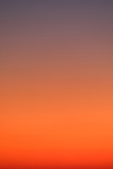 Wall Mural - Gradient sky with warm orange and purple tones. Abstract background for design and print