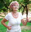 © caftor - Mature woman running in park