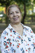 © Pix4Ads - Portrait of an Asian or Indian elder woman arm crossed and looking at camera at park. Attractive, blonde, lovely, elegant and beautiful senior woman spending leisure time copy space