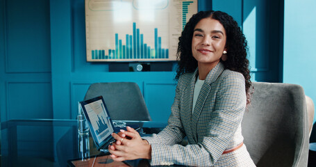 Poster - Portrait, smile and business woman with laptop for finance, investment metrics and data with actuary. Computer, corporate professional and happy employee in office with confidence as risk analyst