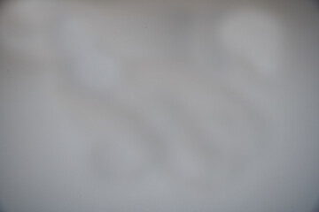 Wall Mural - A blurry gray background with a white line. The line is white and is on the right side of the image