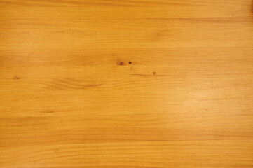 Wall Mural - A wooden surface with a grainy texture. The wood is brown in color. The surface is smooth and has no visible marks