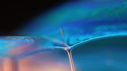 Poster - 	
Deep blue liquid surface on black background, oil stains movement, bright chemistry, surreal background, blue sky colour, connection lines 