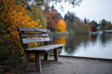 Poster - Empty Wooden Bench Overlooking Lake During Autumn, Representing Tranquility and Outdoor Recreation, Ideal for Travel and Tourism Marketing : Generative AI