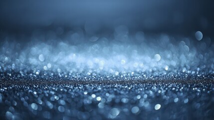 Poster - Soft Blue Bokeh Texture with Magical Sparkles and Gentle Light Reflections on a Smooth Surface Creating a Dreamy Atmosphere for Various Backgrounds