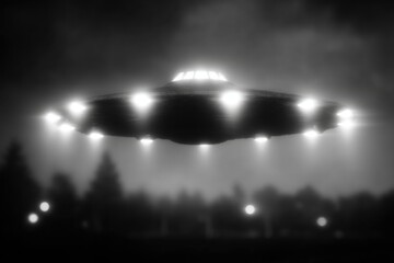 Poster - A black and white photo of an unidentified flying object, UFO, hovering over trees, with bright lights illuminating the area and creating a mysterious atmosphere.