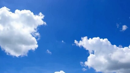 Poster - Azure Canvas: A clear, azure sky is adorned with fluffy, pristine white clouds, creating a serene and uplifting atmosphere.