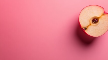 Poster - thin dried apple slice rests on a soft pink background, showcasing its natural textures and colors, 