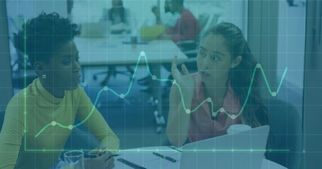 Poster - Business colleagues opening laptop and flipping charts on table, grid overlay pulsing graph lines