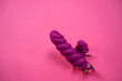 © Михаил Решетников - Raspberry sex toy sticks out of pink paper background. Copy space.