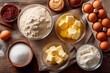 © Віталій Б. - A well-organized setup features bowls of different baking ingredients including flour, butter, sugar, and eggs, perfect for preparing a delicious dessert