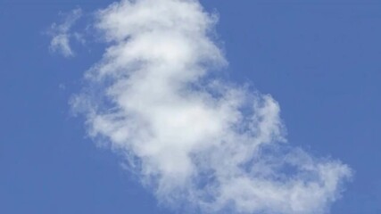 Poster - Azure Dreams: A captivating image of a solitary, puffy cumulus cloud gracefully drifting across an expanse of azure, conveying the serene beauty of nature.