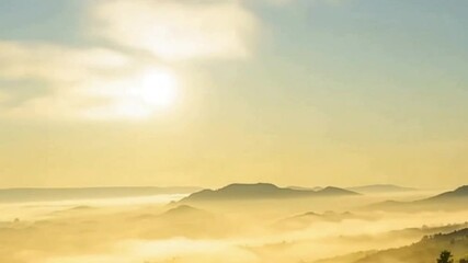 Poster - Misty Mountain Morning: Serene and evocative vista of mountains peeking through a sea of fog, as the golden light of the sun gently illuminates the scene.