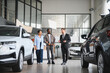 © Serhii - African american couple buying new car at dealership