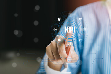 Poster - Business professional selecting Key Performance Indicators using digital touchscreen technology in modern office