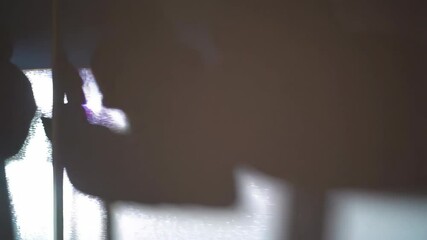 Poster - Abstract view of light reflecting on a curtain's fabric, creating patterns and textures