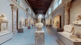 Interior view of a museum gallery featuring classical sculptures and architectural details visible inside