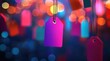© Texture - Vibrant, colorful price tags hang against a bokeh background of blurred lights, suggesting a sale or promotional event