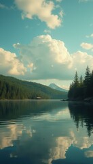Poster - Tranquil lake scene with forest, mountain, and cloud reflections under a blue sky