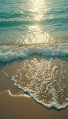 Poster - Sunlight glimmers on the ocean's surface as gentle waves meet a pristine sandy beach, creating a serene coastal scene