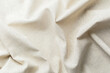 © reddish - Natural beige fabric textile with soft folds and texture close up