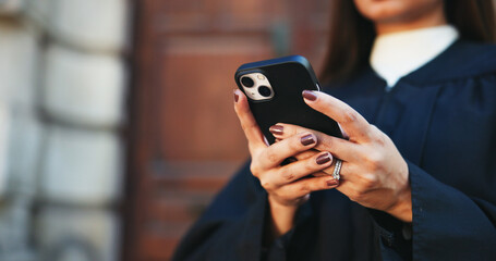 Poster - Cellphone, hands and businesswoman in city with communication, contact or email with legal client. Phone, research and closeup of female attorney with online networking for law case in urban town.
