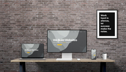Leinwandbilder - Responsive web design concept displayed on desktop, laptop, and smartphone, with ‘We build websites’ headline and brick wall background