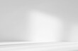 © Lyubov - Abstract white studio background with shadows of window. Empty 3d gray room with copy space. Display product with blurred backdrop.