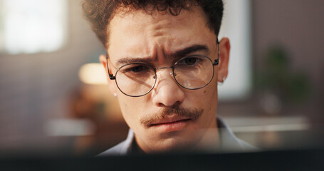 Leinwandbilder - Glasses, laptop and man in home for remote work, startup business and freelance career with confused face. Unsure, house and person on computer for reading website, project report and research